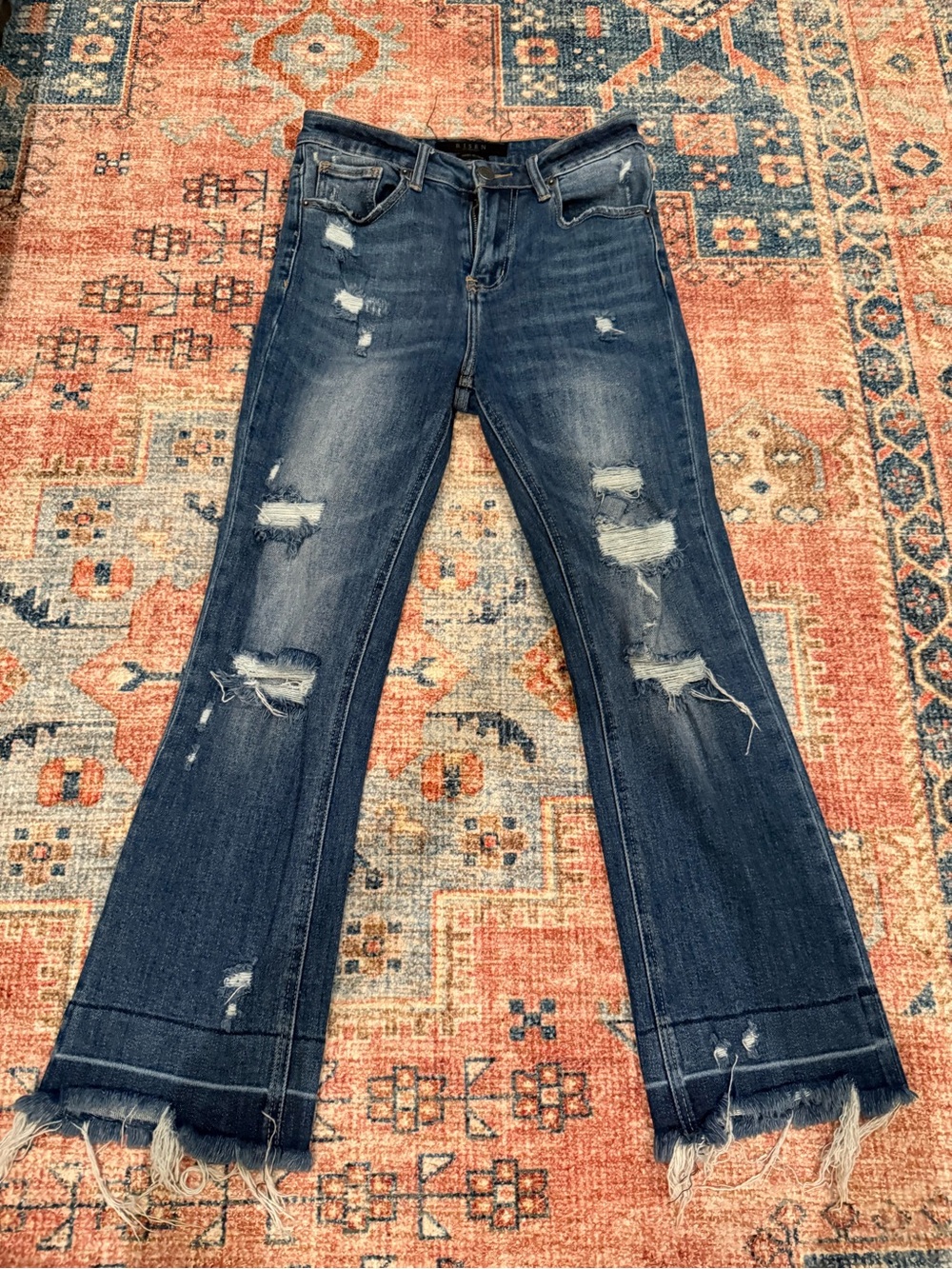 Distressed Dark Blue Flare Jeans with Raw Hem